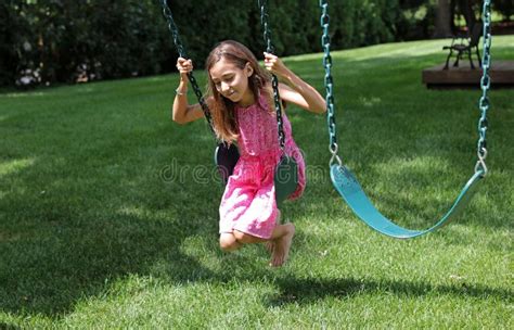 upskirt girl|Child In Pink Skirt Swings In Park During Stock Footage